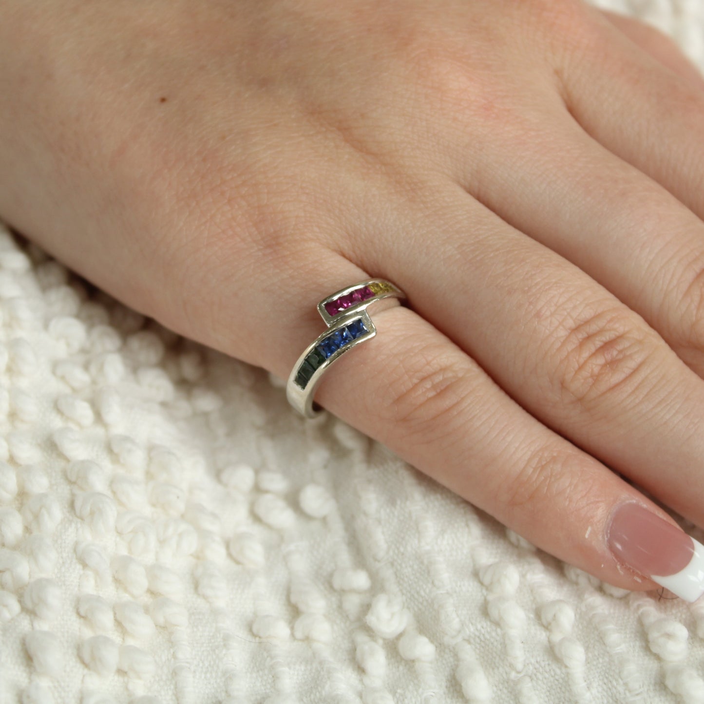 14kt White Gold Princess Cut Rainbow Sapphire Channel Set Bypass Ring