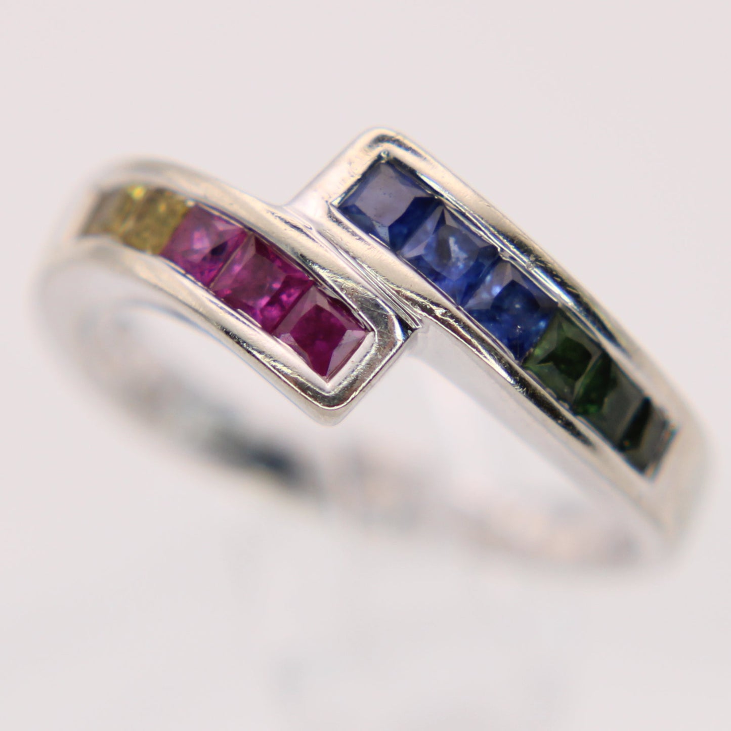 14kt White Gold Princess Cut Rainbow Sapphire Channel Set Bypass Ring