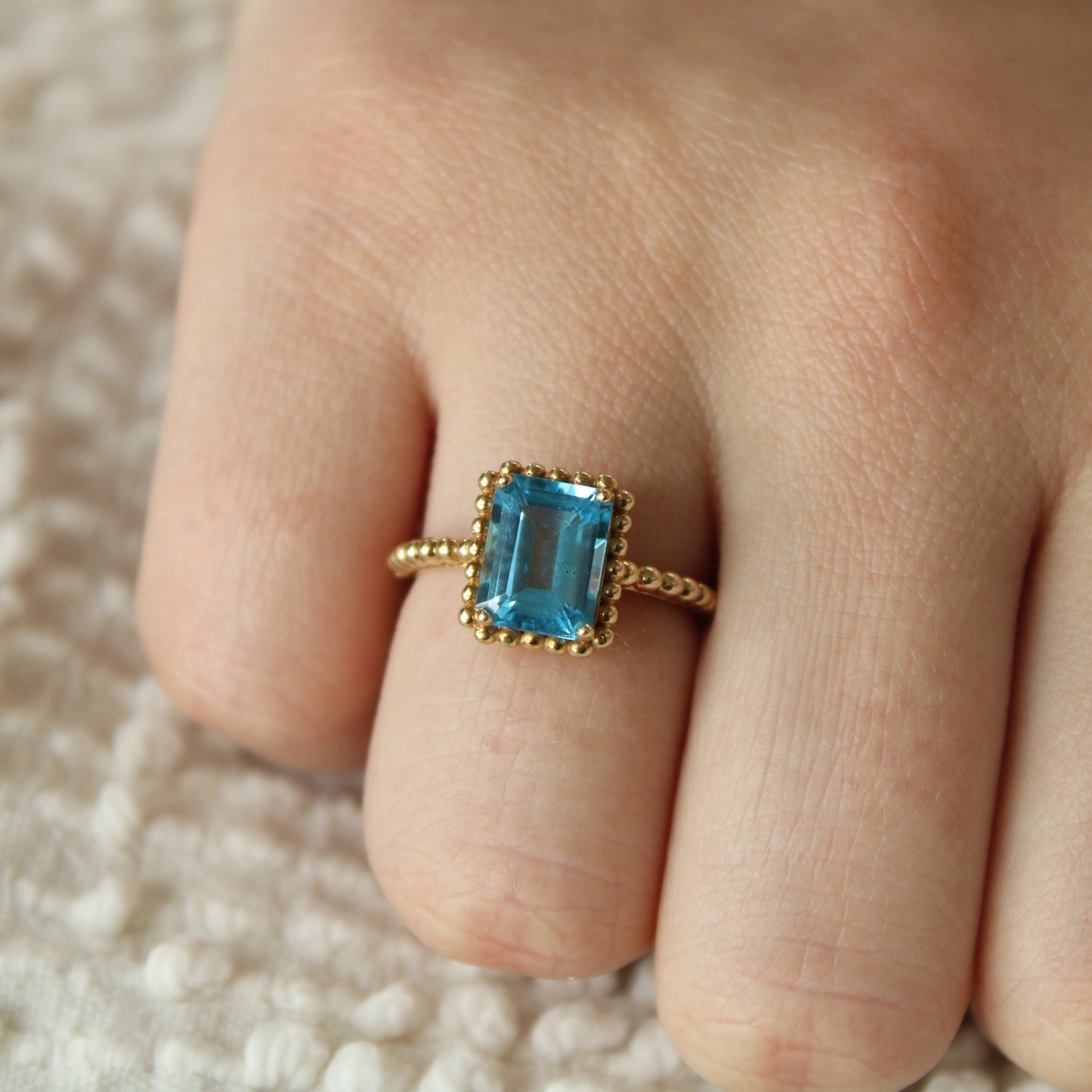10kt Yellow Gold 2 CT Blue Topaz Emerald Cut Beaded Frame Cocktail Ring